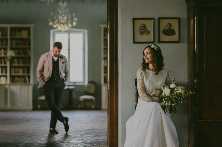 Bride Two Piece Lace Bridal Gown Floral Hairpiece Bouquet White Florals Greenery White Ribbon Groom Light Blue Shirt Sand Jacket Dark Grey Vest Brown Pants Patterned Bowtie Natural Greenery Stylish Wedding Transylvania https://raresion.com/