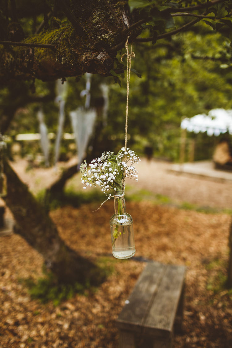Hanging Bottle Flowers Trees Pretty DIY Outdoor Village Hall Wedding https://photography34.co.uk/