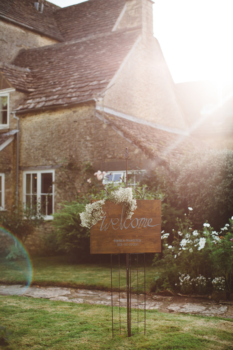 Wooden Rustic Welcome Sign Flowers Cotswolds Country House Marquee Wedding http://www.wearegatheredheretoday.com/