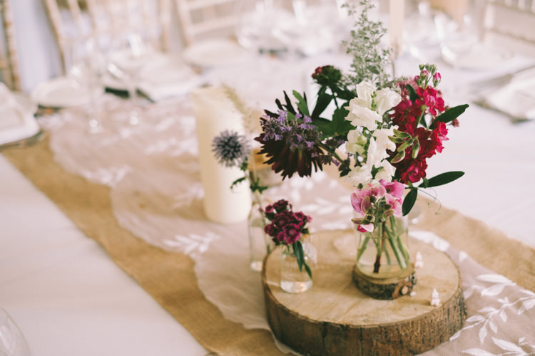 Log Slice Flowers Jars Pretty Light Pink Country House Wedding http://jonathanryderphotography.com/