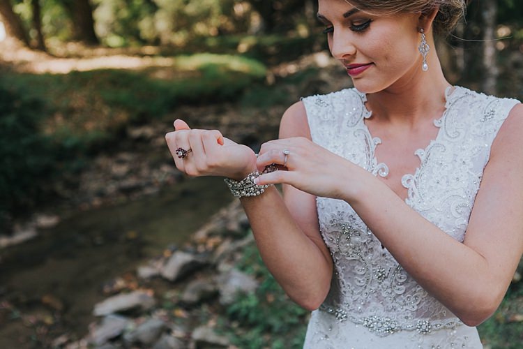 Bride V Neck Lace Embellished Bridal Gown Drop Crystal Pearl Earrings Pearl Bracelet Bohemian & Whimsical Garden Wedding in North Carolina http://www.taylorparkerphotography.com/