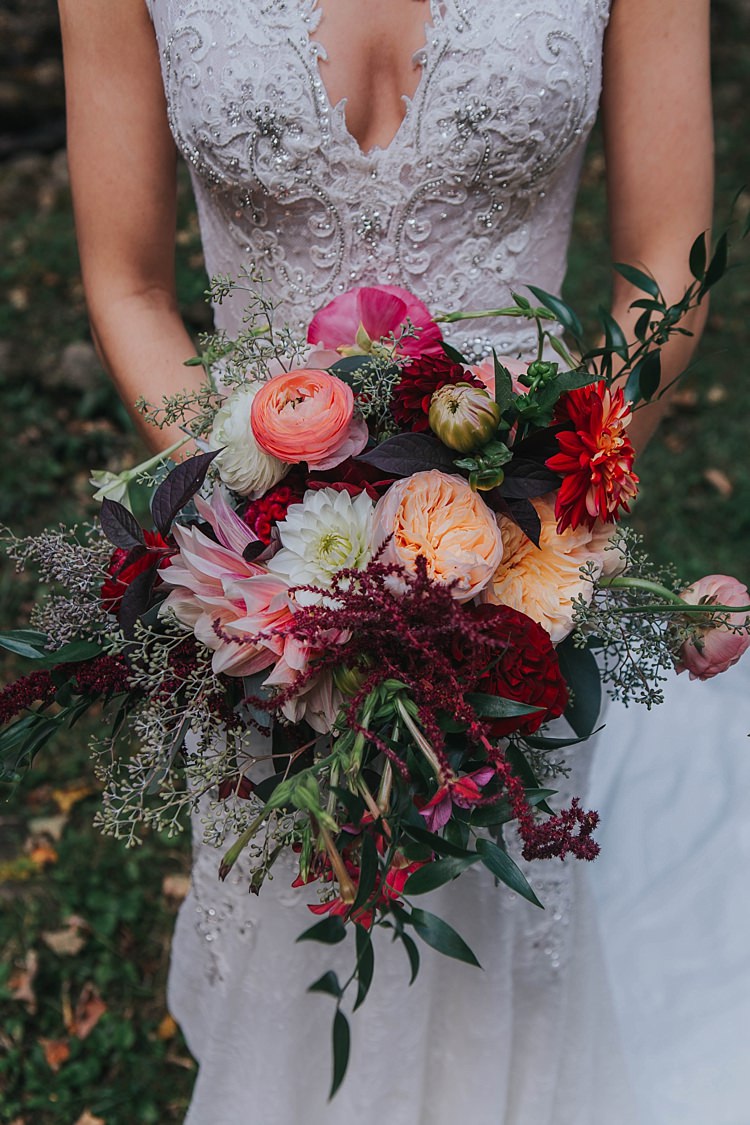 Bride Lace V Neck Embellished Bridal Gown Multicoloured Bouquet Dahlia Tea Rose Florals Greenery Bohemian & Whimsical Garden Wedding in North Carolina http://www.taylorparkerphotography.com/