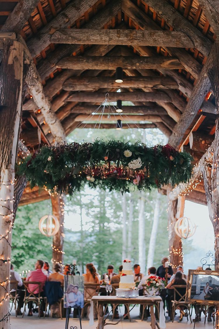 Reception Fairy Lights Large Hanging Décor Greenery Florals Lanterns Wedding Cake Guests Bohemian & Whimsical Garden Wedding in North Carolina http://www.taylorparkerphotography.com/