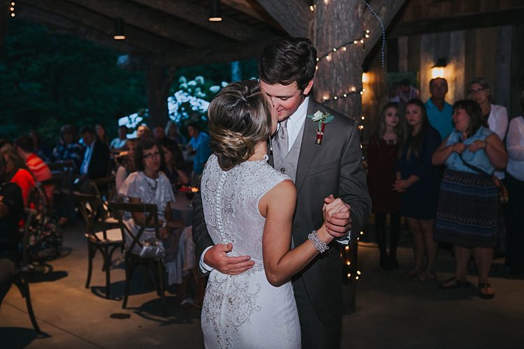 Reception First Dance Bride V Neck Lace Embellished Gown Groom Grey Suit White Shirt Light Grey Tie Vest Shotgun Shell Floral Buttonhole Guests Bohemian & Whimsical Garden Wedding in North Carolina http://www.taylorparkerphotography.com/