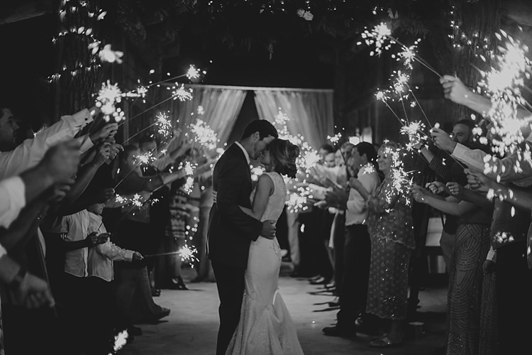 Reception Bride V Neck Lace Embellished Gown Groom Grey Suit White Shirt Guests Sparkler Exit Bohemian & Whimsical Garden Wedding in North Carolina http://www.taylorparkerphotography.com/