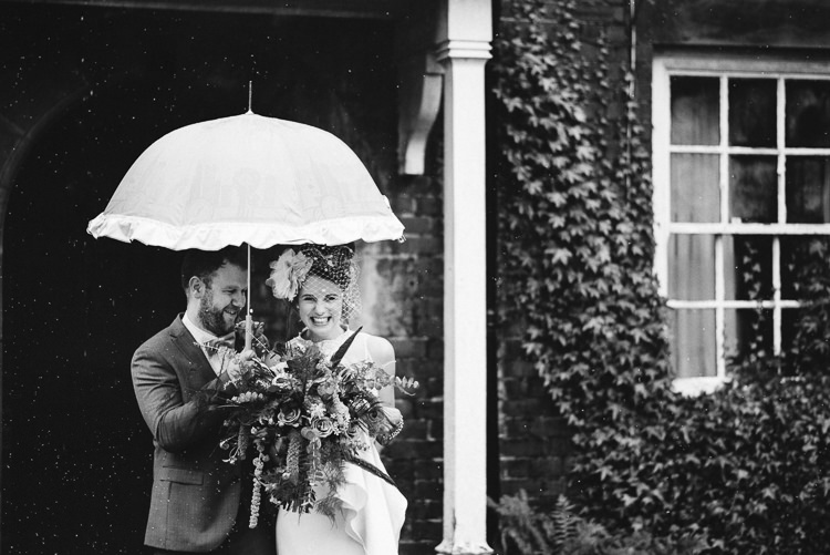 Rainy Rain Umbrella Quirky Stylish Country House Wedding http://www.stevebridgwoodphotography.co.uk/