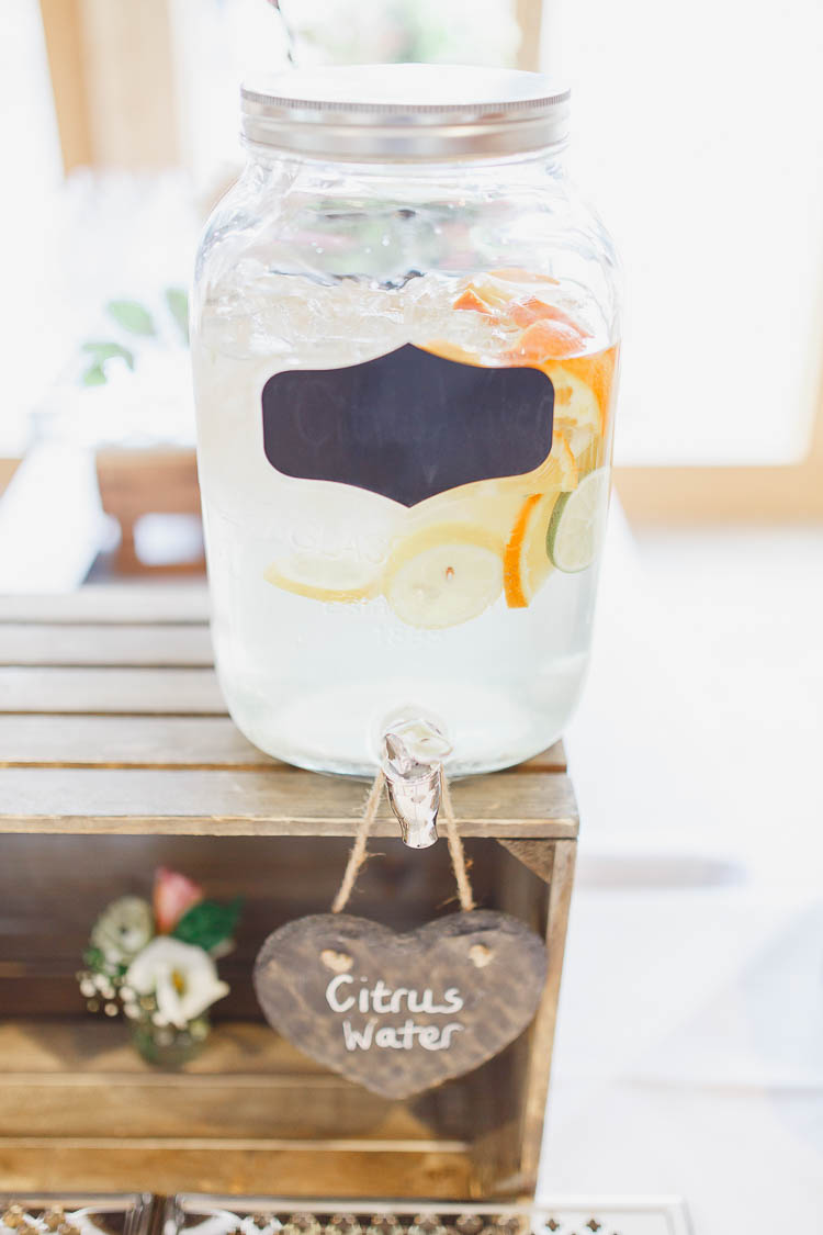 Drink Dispenser Bar Welcome Beautiful Rustic Fairy Lights Barn Wedding http://whitestagweddings.com/