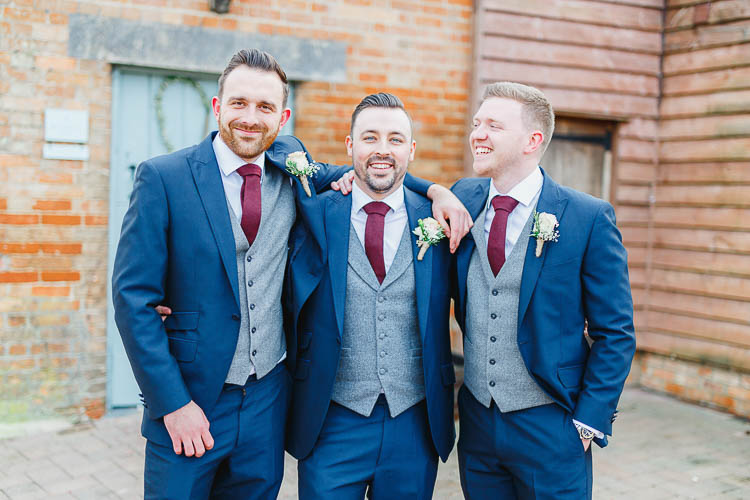Blue Suits Red Tie Grey Waistcoast Groom Groomsmen Beautiful Rustic Fairy Lights Barn Wedding http://whitestagweddings.com/
