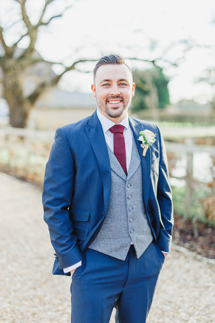 Blue Suit Groom Grey Waistcoat Red Tie Beautiful Rustic Fairy Lights Barn Wedding http://whitestagweddings.com/