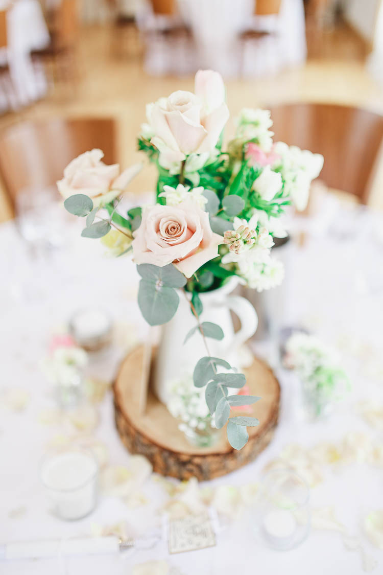 Centrepiece Log Jug Flowers Pink Cream Beautiful Rustic Fairy Lights Barn Wedding http://whitestagweddings.com/