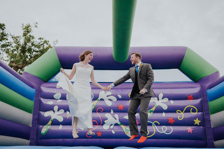 Bouncy Castle Bride Groom Stylish Hand Made Rainy Summer Barn Wedding http://www.kategrayphotography.com/