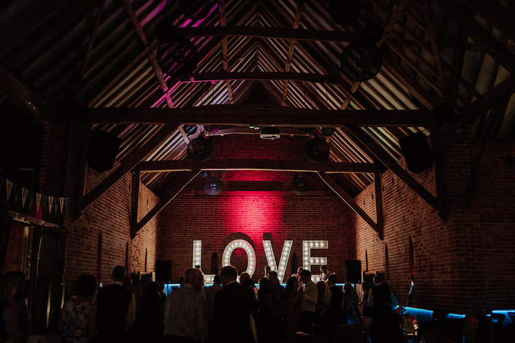 LOVE Letter Lights Barn Stylish Hand Made Rainy Summer Barn Wedding http://www.kategrayphotography.com/