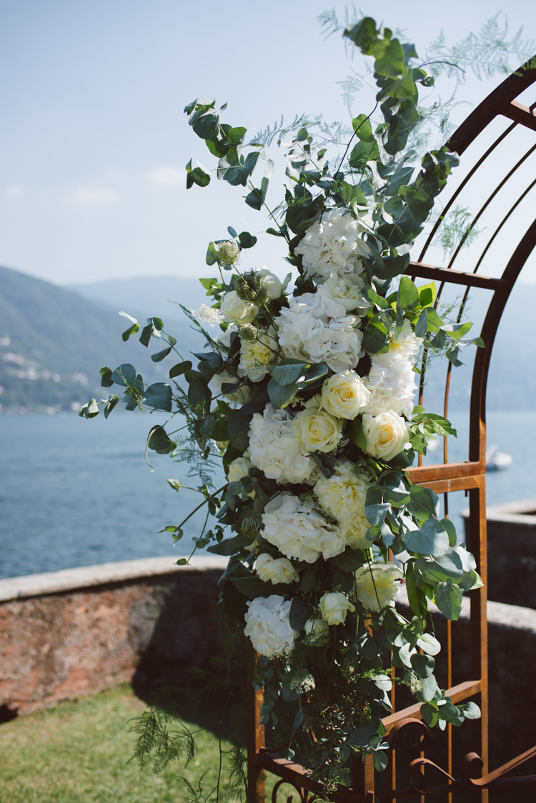 Outdoor Ceremony Rusted Archway White Cream Florals Greenery Lake View Botanical Copper Greenery Lake Como Wedding http://margheritacalatiphotography.com/