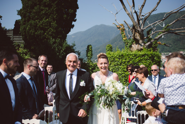Outdoor Ceremony Bride V Neck Jenny Packham Embellished Bridal Gown Bouquet White Cream Florals Greenery Father Entrance Guests Botanical Copper Greenery Lake Como Wedding http://margheritacalatiphotography.com/