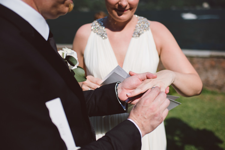 Outdoor Ceremony Bride V Neck Jenny Packham Embellished Bridal Gown Groom Tailored Black Suit White Shirt Black Tie Floral Buttonhole Ring Exchange Botanical Copper Greenery Lake Como Wedding http://margheritacalatiphotography.com/