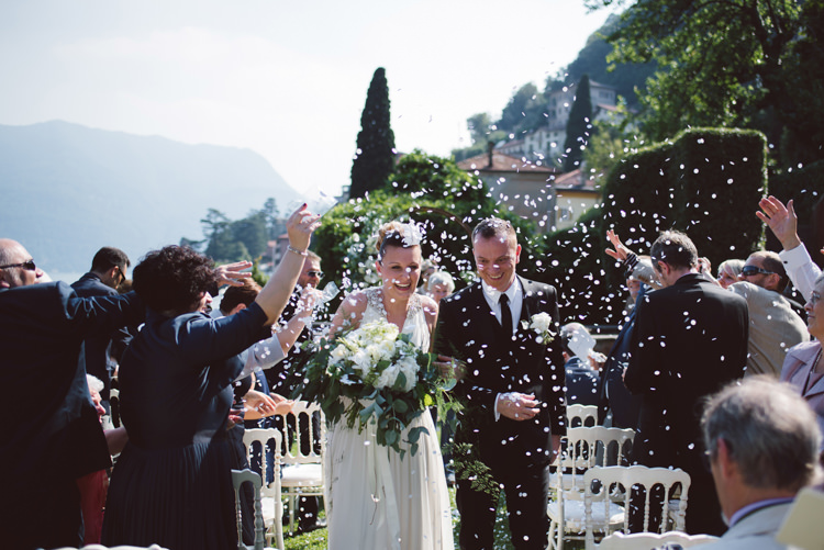 Outdoor Ceremony Bride V Neck Jenny Packham Embellished Bridal Gown Bouquet White Cream Florals Greenery Groom Tailored Black Suit White Shirt Black Tie Floral Buttonhole Confetti Guests Botanical Copper Greenery Lake Como Wedding http://margheritacalatiphotography.com/