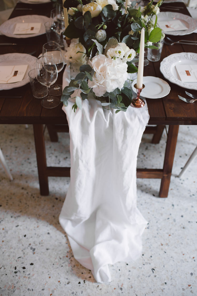 Reception Long Wooden Table White Table Runner White Florals Greenery Copper Candlesticks White Patterned China Botanical Copper Greenery Lake Como Wedding http://margheritacalatiphotography.com/