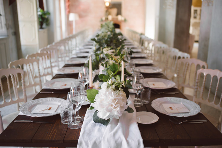 Reception Long Wooden Table White Chairs White Runner White Florals Greenery Candlesticks Patterned China Botanical Copper Greenery Lake Como Wedding http://margheritacalatiphotography.com/