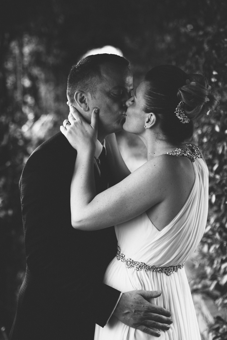 Bride V Neck Jenny Packham Embellished Bridal Gown Crystal Hairpiece Groom Tailored Black Suit White Shirt Black Tie Botanical Copper Greenery Lake Como Wedding http://margheritacalatiphotography.com/