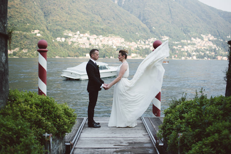 Bride V Neck Jenny Packham Embellished Bridal Gown Groom Tailored Black Suit White Shirt Black Tie Botanical Copper Greenery Lake Como Wedding http://margheritacalatiphotography.com/