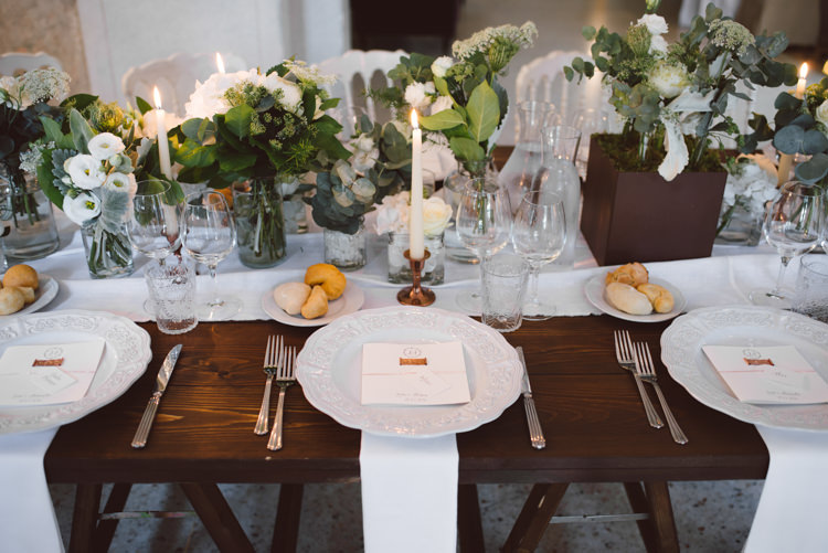 Reception Wooden Table White Table Runner White Chairs White Florals Greenery Copper Candlesticks White Patterned China Menu Botanical Copper Greenery Lake Como Wedding http://margheritacalatiphotography.com/