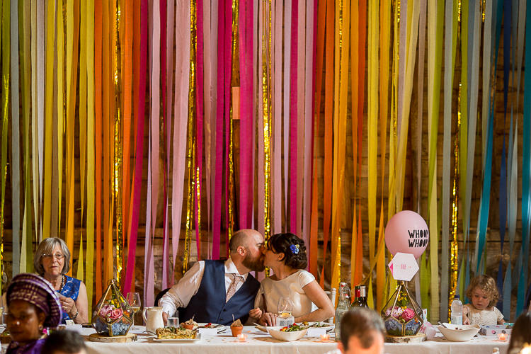 Rainbow Ribbon Backdrop Top Table Fun Multicolour Creative Barn Wedding http://www.mattparryphotography.co.uk/