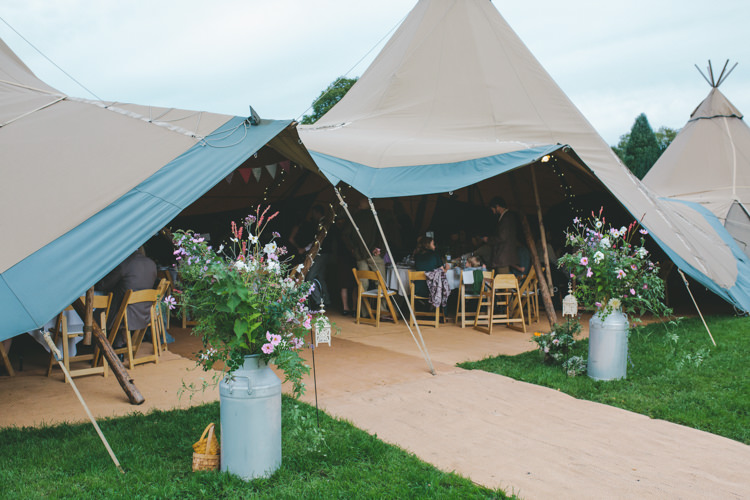 Tipi Urn Flowers Delightfully Natural Pretty Garden Wedding http://www.elliegracephotography.co.uk/