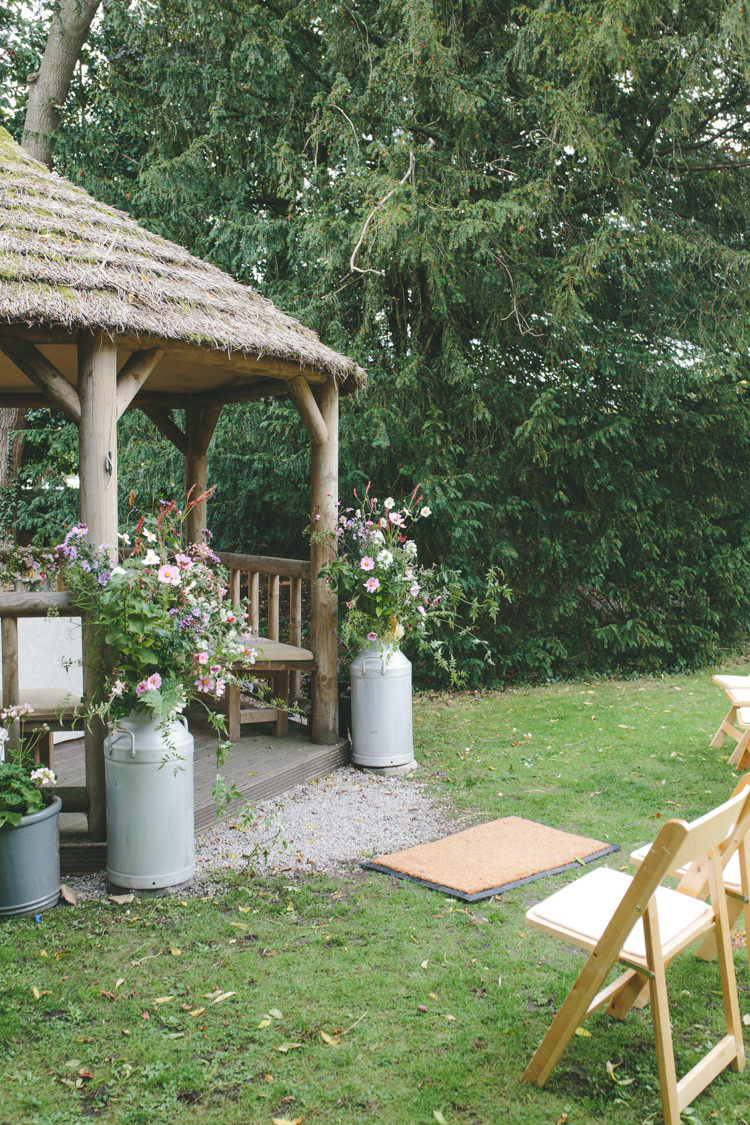 Urn Flowers Outdoor Ceremony UK Delightfully Natural Pretty Garden Wedding http://www.elliegracephotography.co.uk/