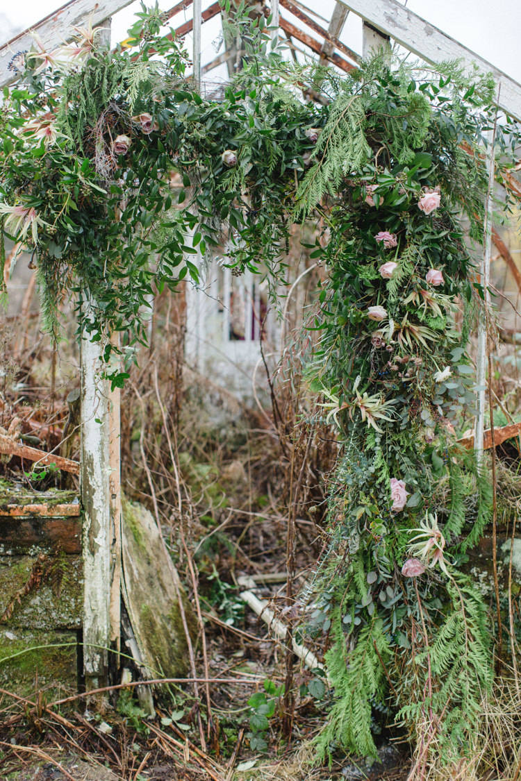 Flower Arch Backdrop Doorway Ceremony Greenery Foliage Botanical Beauty Abandoned Greenhouse Wedding Ideas https://www.thegibsonsphotography.co.uk/
