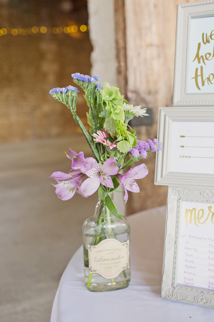 Lavender Bottle VIntage Flowers Details Table Plan Colour Pop Summer French Chateau Wedding http://www.cottoncandyweddings.co.uk/