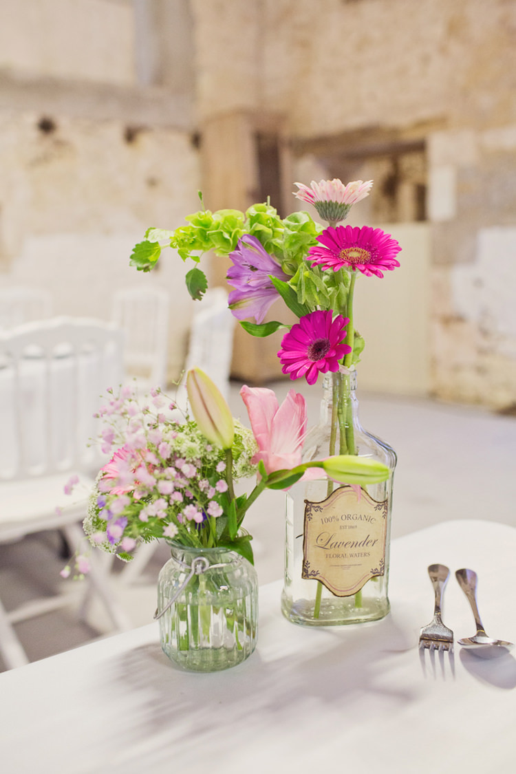 Vintage Lavender Bottle Flowers Table Decoration Centre Colour Pop Summer French Chateau Wedding http://www.cottoncandyweddings.co.uk/