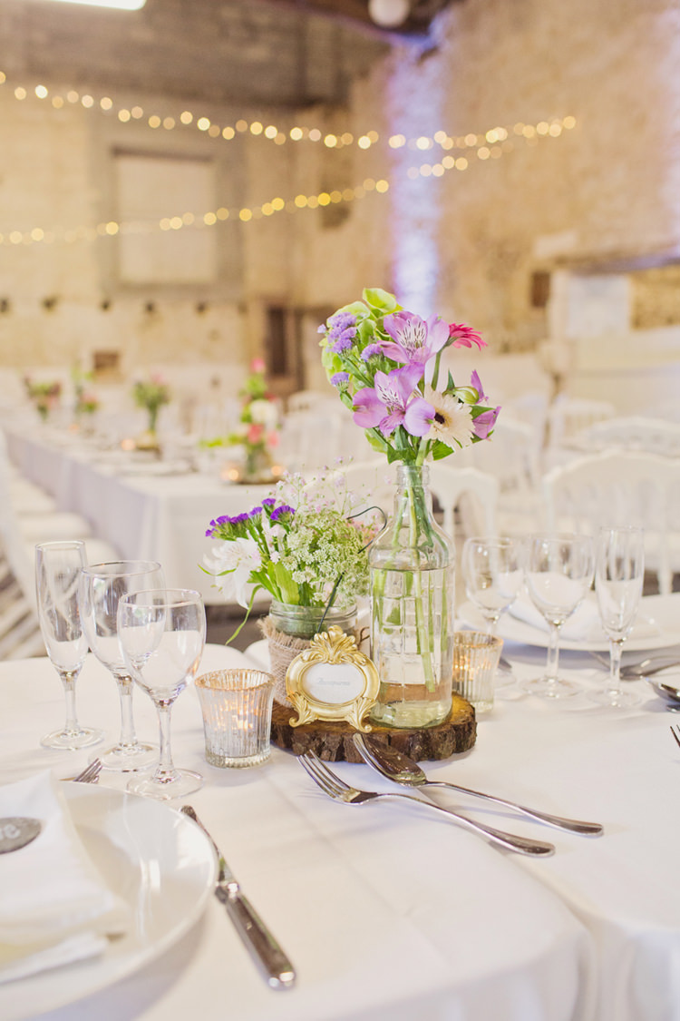 Table Centre Flowers Frame Bottle Hessian Twine Candle Votive Wood Slice Colour Pop Summer French Chateau Wedding http://www.cottoncandyweddings.co.uk/