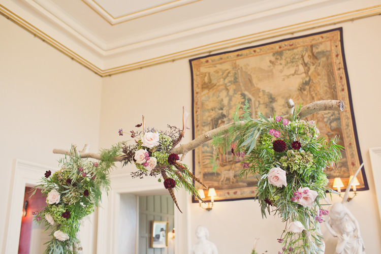 Red Burgundy Dahlia Blush Flowers Arch Foliage Rose Antler Feather Stunning Countryside Wedding http://www.cottoncandyweddings.co.uk/