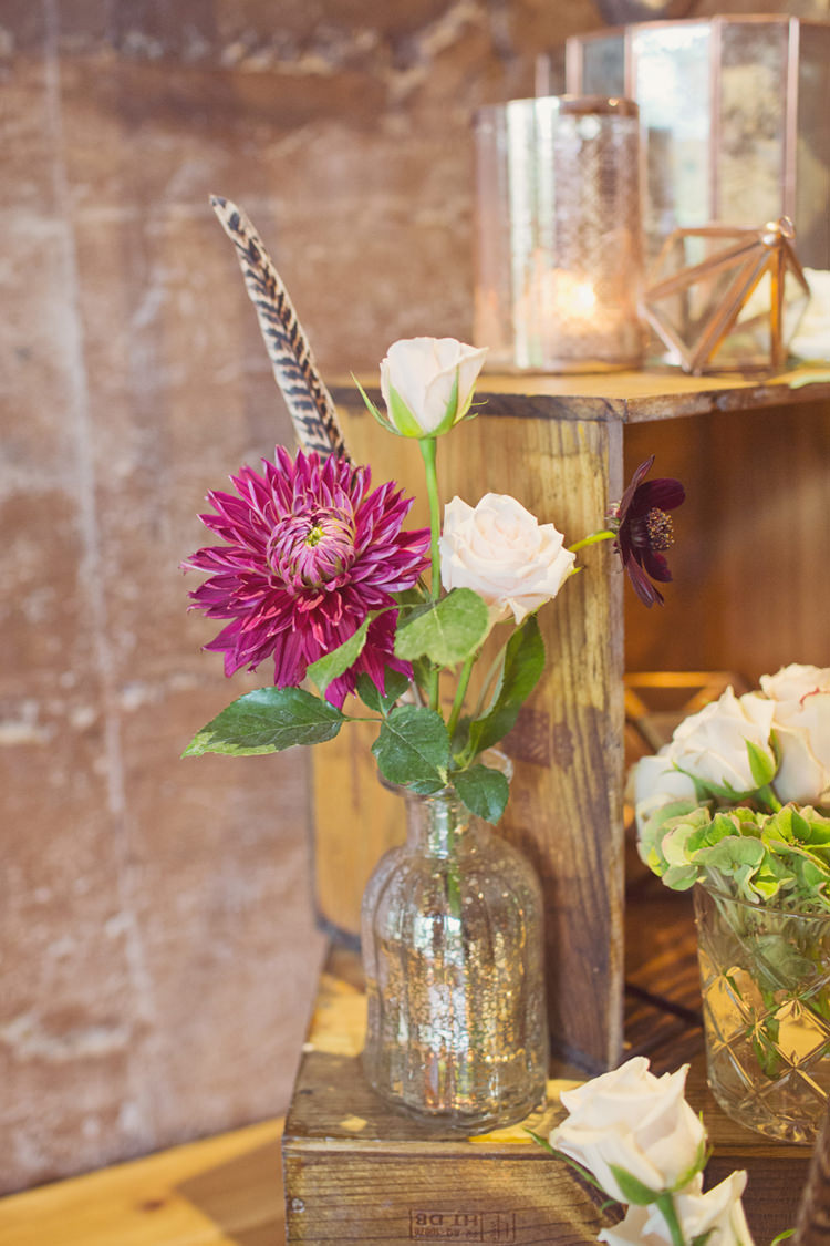 Flower Bottles Decor Antler Feather Stunning Countryside Wedding http://www.cottoncandyweddings.co.uk/