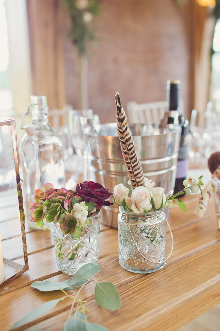 Jar Flowers Tables Antler Feather Stunning Countryside Wedding http://www.cottoncandyweddings.co.uk/