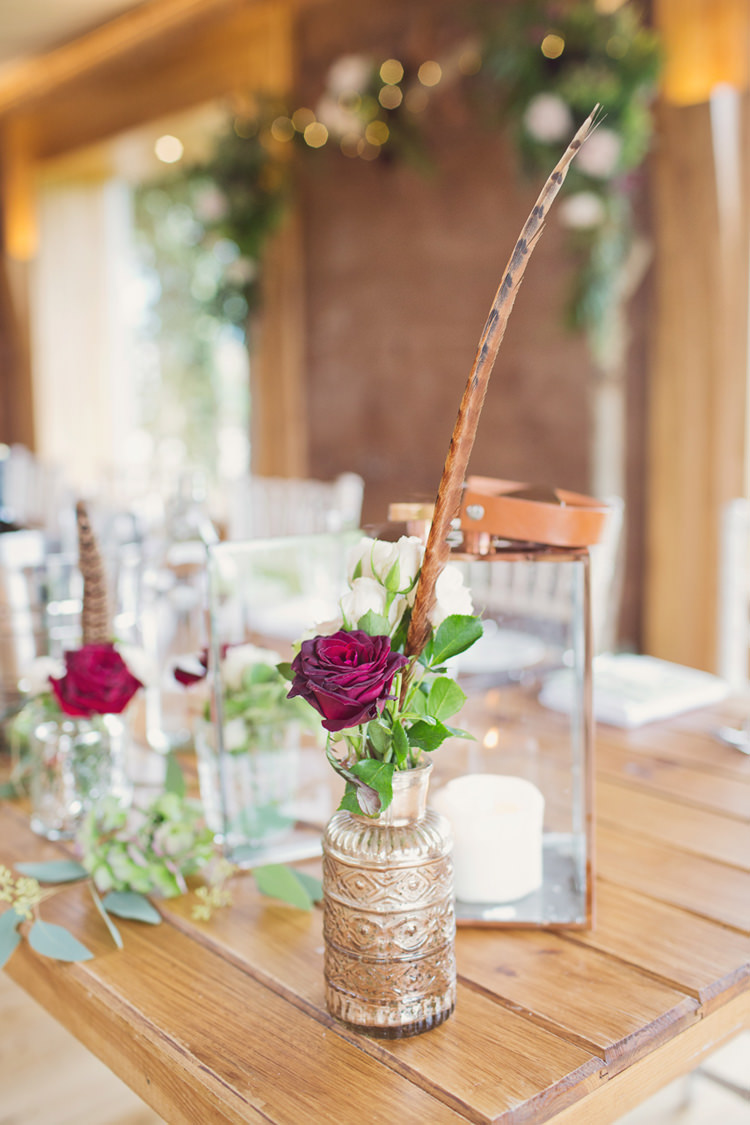 Bottle Flowers Decor Antler Feather Stunning Countryside Wedding http://www.cottoncandyweddings.co.uk/