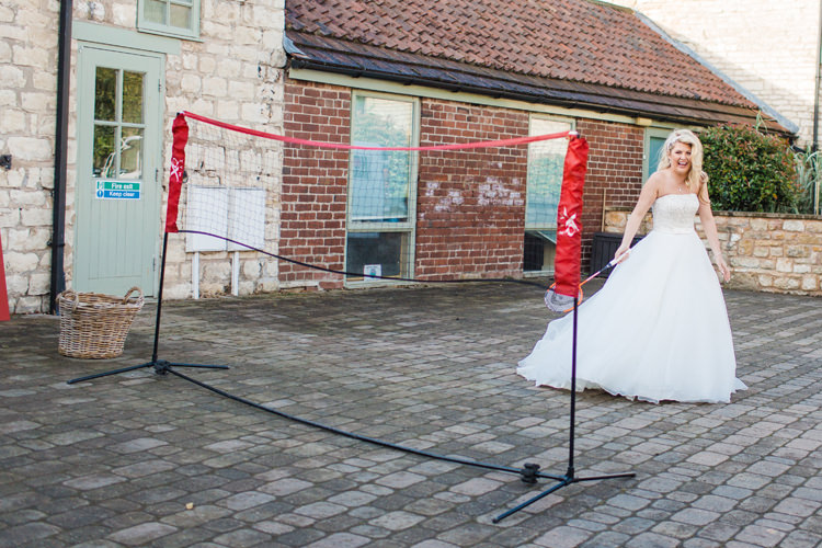 Lawn Games Outdoor Activities Bride Bridal A-Line Dress Badminton Burgundy Gold Rustic Glam Barn Wedding http://www.terripashleyphotography.co.uk/