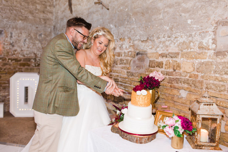Cake Cutting Table Lantern Wood Slice Gold White Flowers Roses Burgundy Gold Rustic Glam Barn Wedding http://www.terripashleyphotography.co.uk/