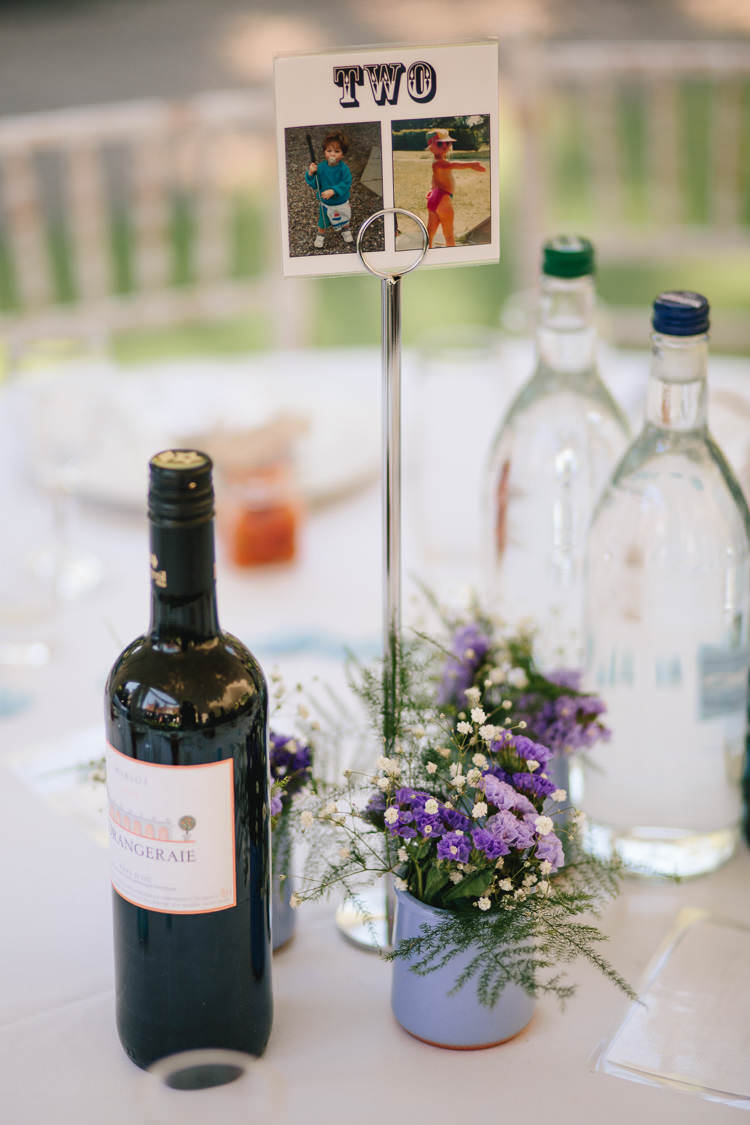 Table Number Centre Pot Gypsophila Purple Flowers Pretty Picturesque Outdoor Castle Wedding https://parkershots.com/
