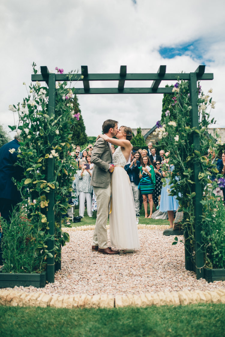 Outdoor Ceremony Arch Flowers Wildflower Village Green Handfasting Wedding http://www.naomijanephotography.com/