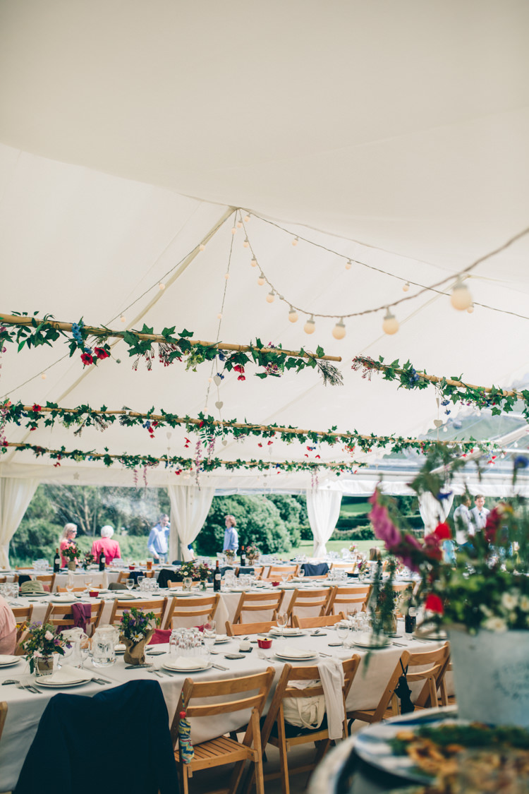 Marquee Festoon Lights Hanging Foliage Flowers Greenery Wildflower Village Green Handfasting Wedding http://www.naomijanephotography.com/