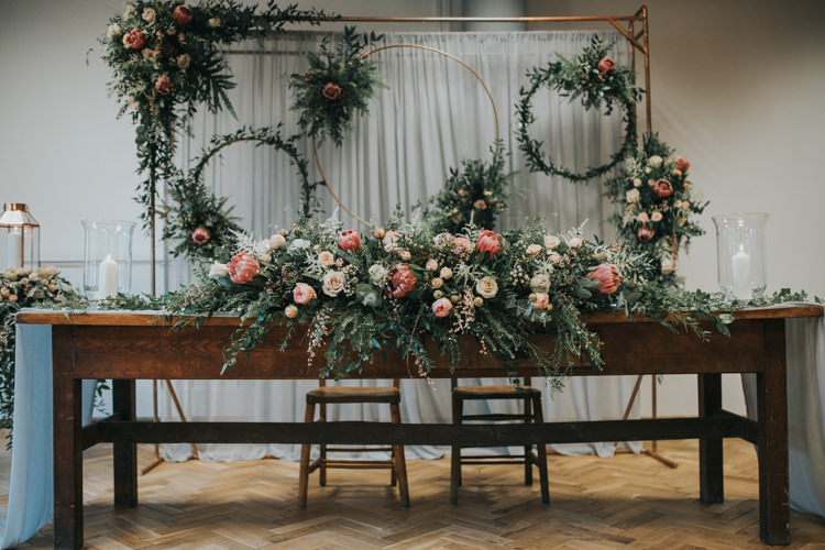 Ceremony Flowers Backdrop Hoops Foliage Aisle Pew End Chairs Table Industrial Into The Wild Greenery Wedding Ideas http://www.ivoryfayre.com/