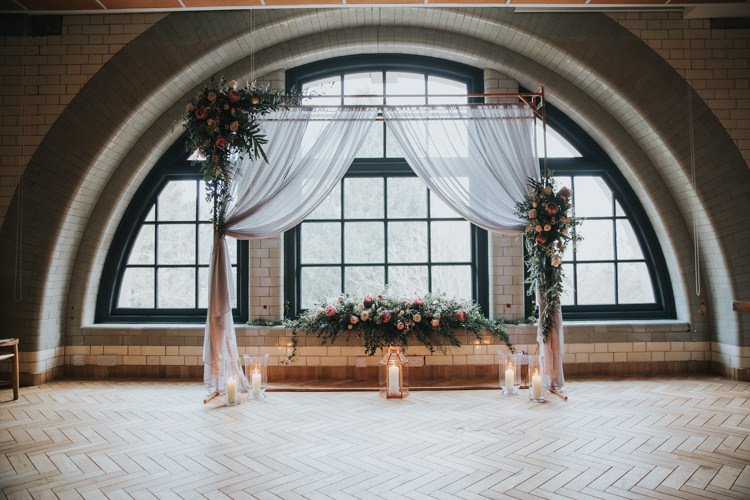 Arch Backdrop Flowers Fabric Candles Industrial Into The Wild Greenery Wedding Ideas http://www.ivoryfayre.com/
