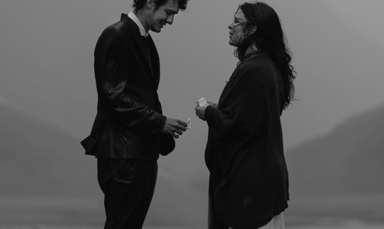 Bride Beaded Chiffon Bridal Gown Black Wrap Groom Black Tailored Suit White Shirt Black Tie Exchanging Vows Rain Breathtaking Wild Scotland Elopement http://www.theferros.com/