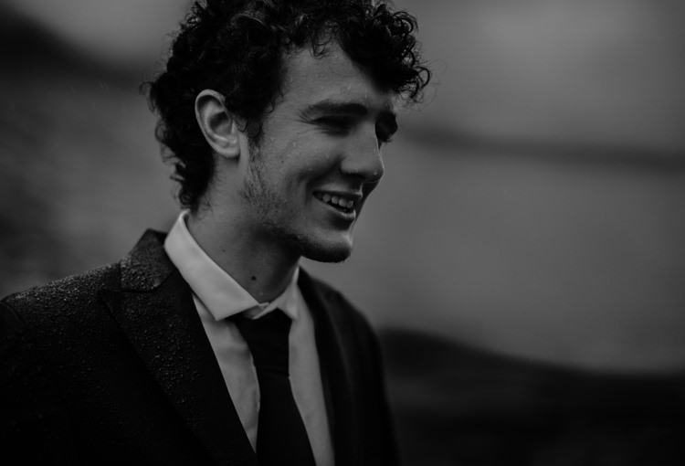 Groom Tailored Black Suit White Shirt Black Tie Rain Breathtaking Wild Scotland Elopement http://www.theferros.com/