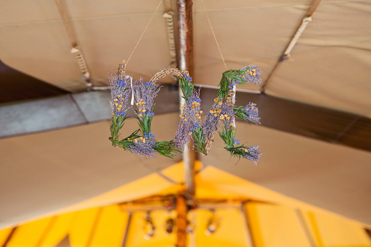 LOVE Letter Flowers Decor Relaxed Festival Tipi Wedding http://www.cottoncandyweddings.co.uk/