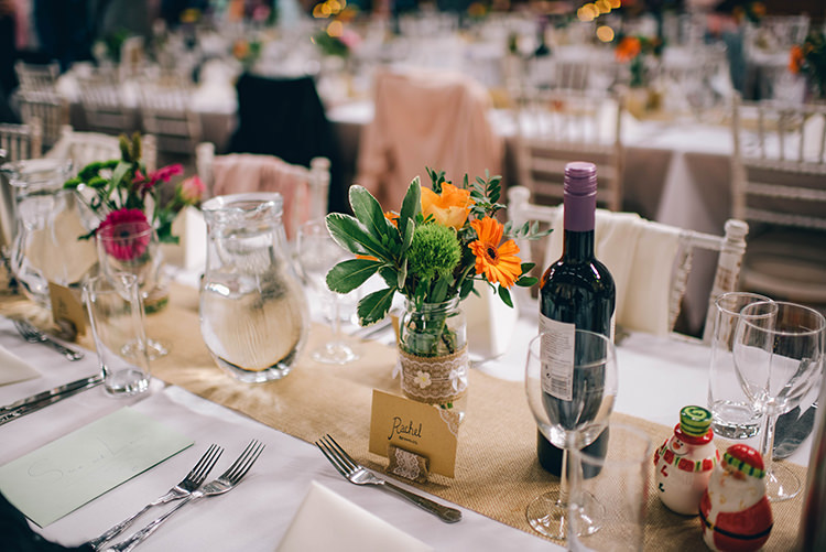 Table Setting Jars Multicoloured Flowers Hessian Colourful Fun Party Brighton Wedding http://jmcsweeneyphotography.co.uk/