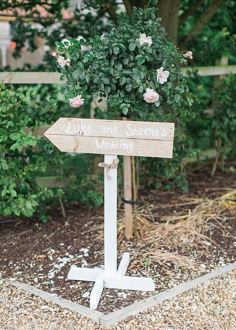 Rustic Direction Sign Wooden Post Romantic Soft Pastels Barn Wedding http://www.sungblue.com/