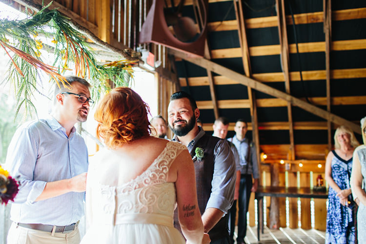 Indoor Barn Ceremony Bride Lace Tulle Bridal Gown Groom Light Grey Shirt Custom Vest Celebrant Floral Arch Guests Creative Quirky Rustic Barn Wedding Tennessee http://www.alexbeephoto.com/