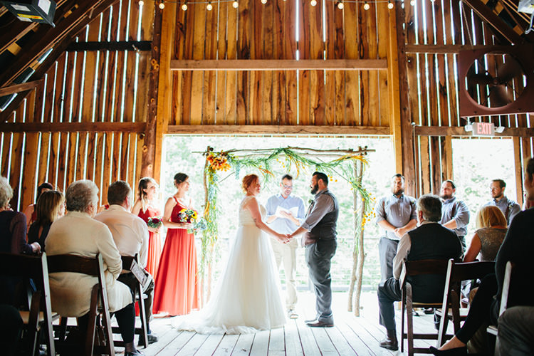 Indoor Barn Ceremony Bride Lace Tulle Bridal Gown Groom Light Grey Shirt Custom Vest Celebrant Bridesmaids Groomsmen Floral Arch Guests Fairy Lights Creative Quirky Rustic Barn Wedding Tennessee http://www.alexbeephoto.com/
